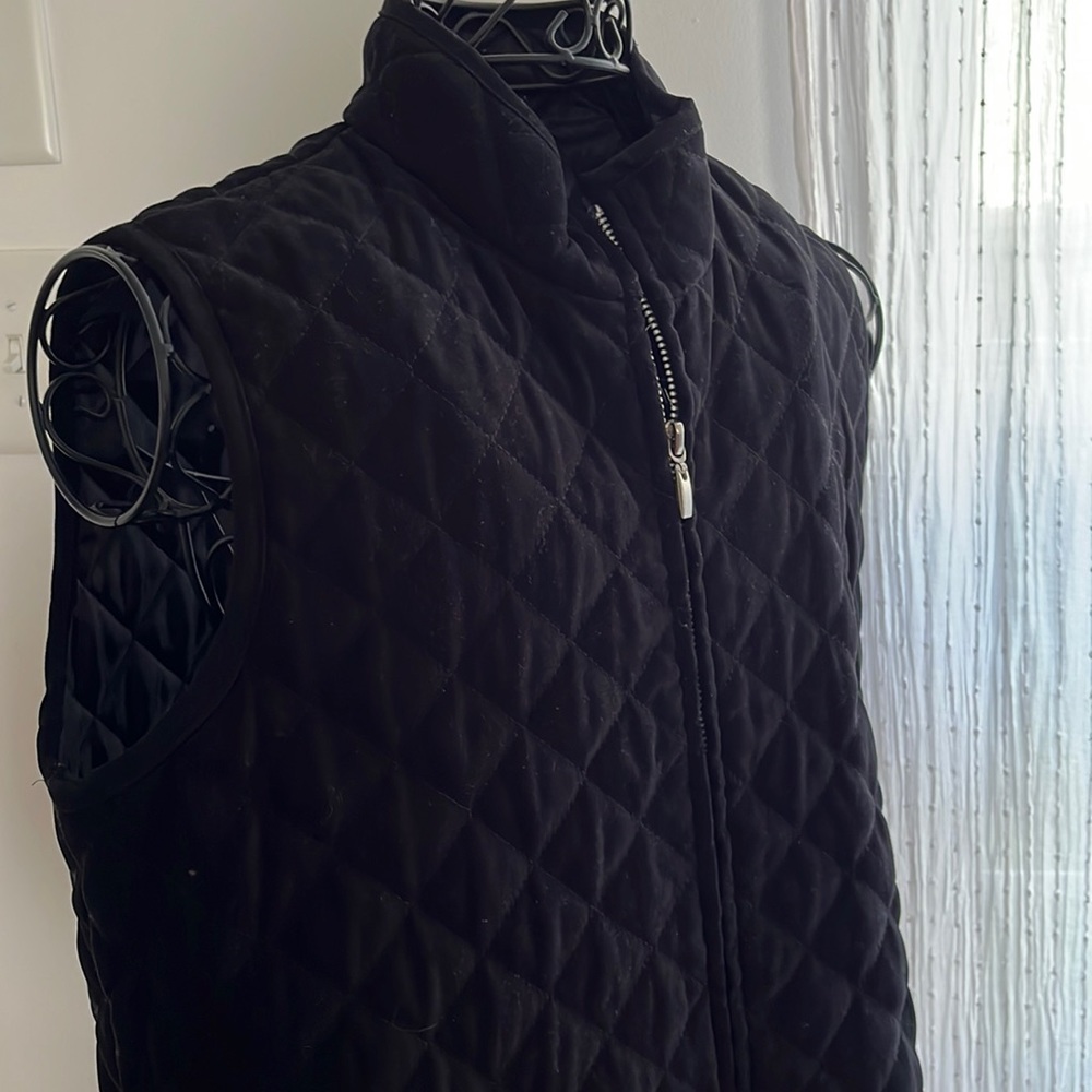 Soft quilted black vest, with pockets. High collar. Great condition. Size med.